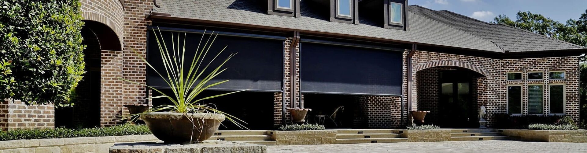 Motorized retractable hurricane screens on a Florida home